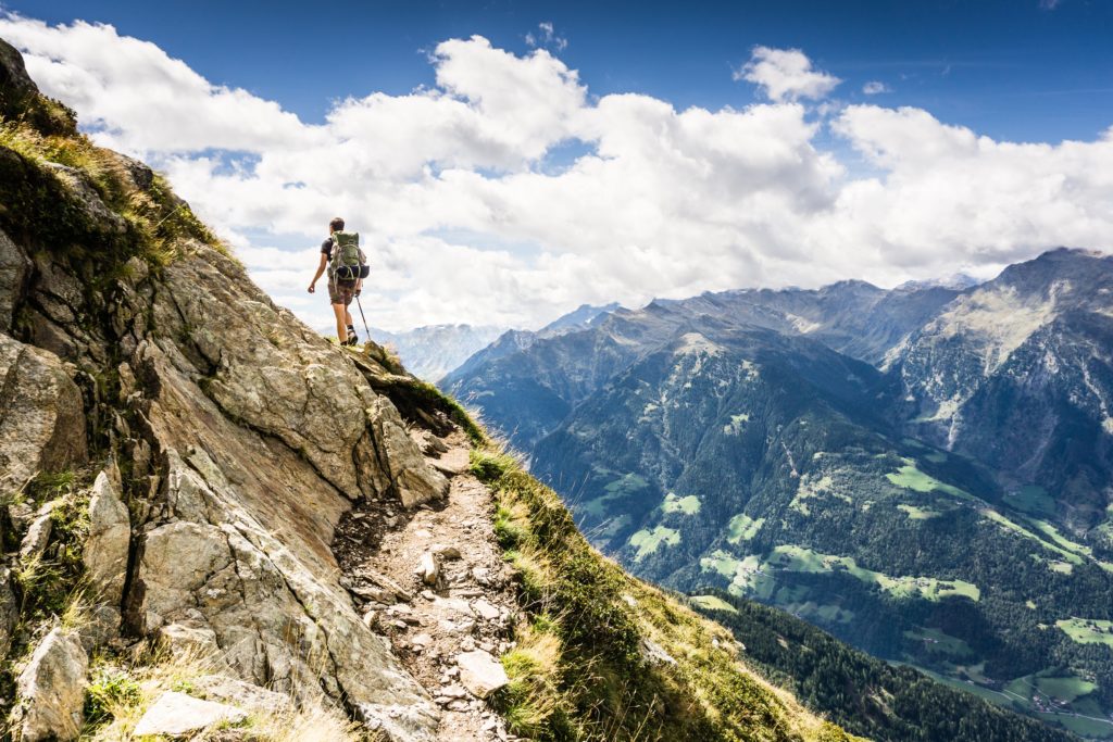 Man Hiking on Mountain - Level Up Coaching