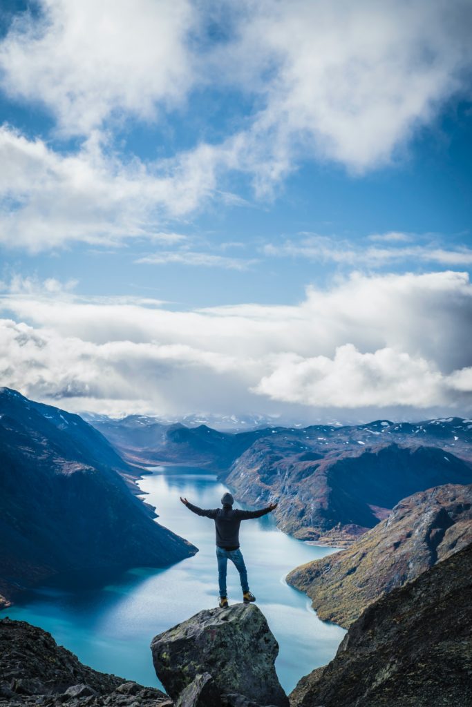 Man Standing on Mountain - Level Up Coaching